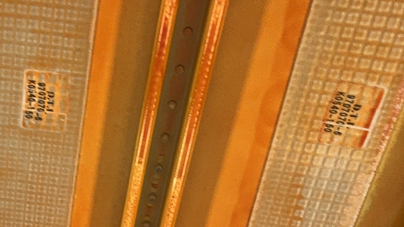 The same photo at full resolution: part markings stencilled on the skin panels